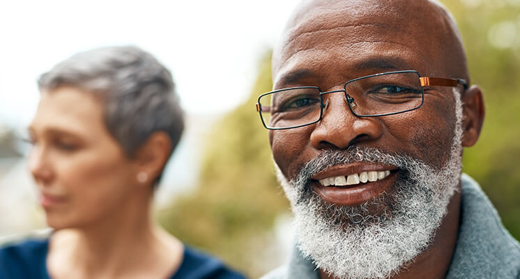 man with glasses smiling