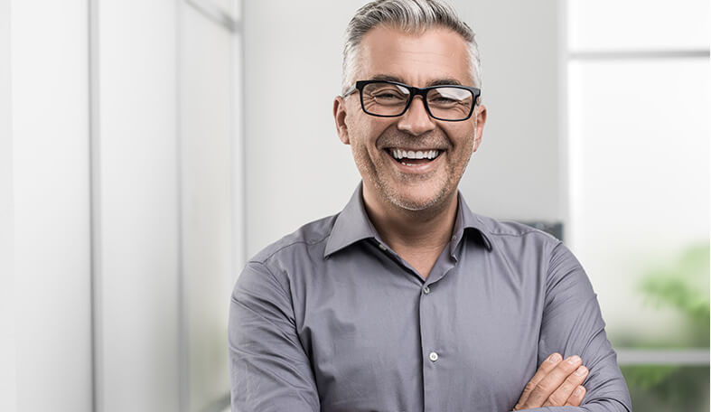 man with bridges smiling