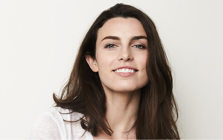 woman with crowns smiling