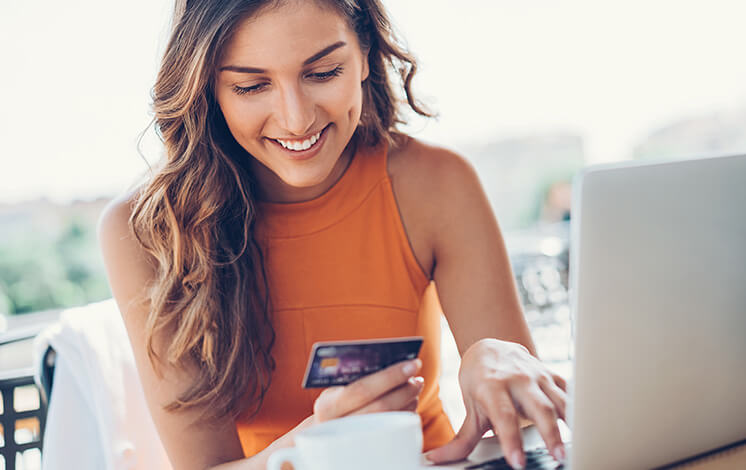 smiling woman on computer