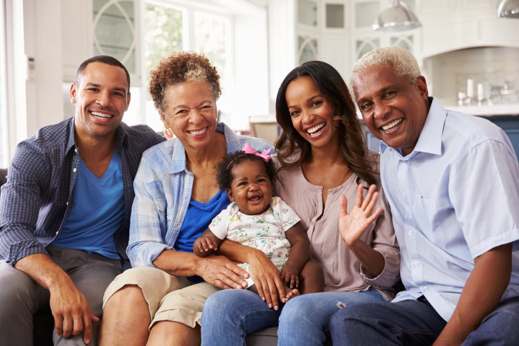 A multigenerational family of a mom, dad, grandma, grandpa, and granddaughter