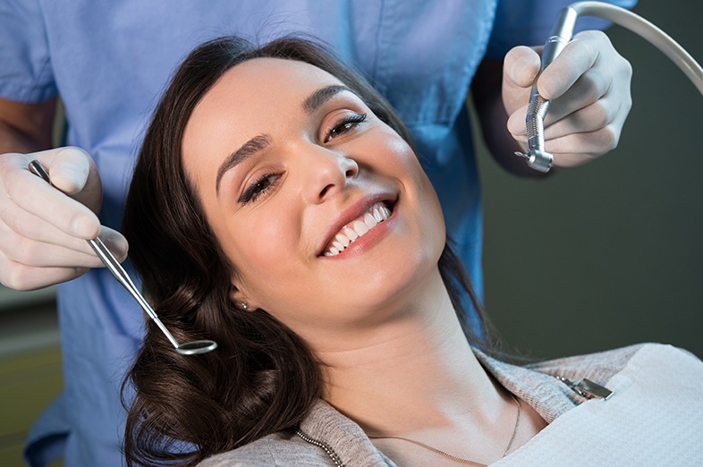 Woman smiling in a dental chair