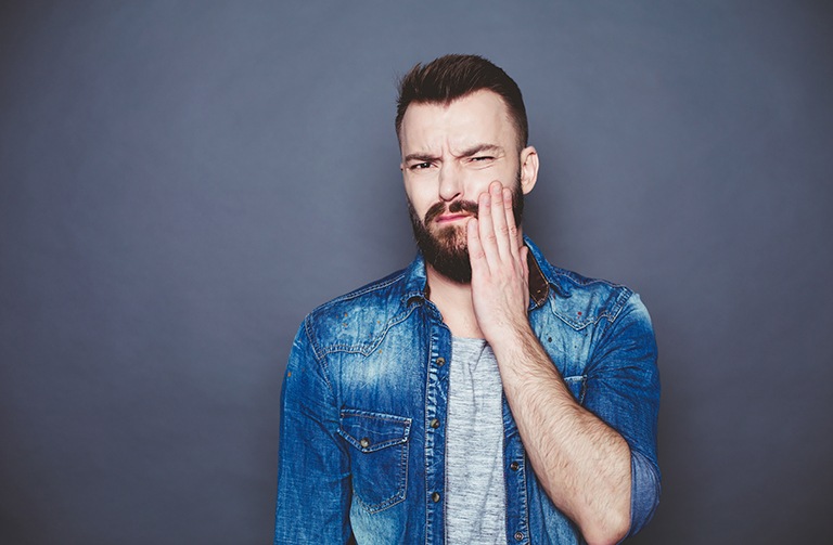 Man with a painful tooth